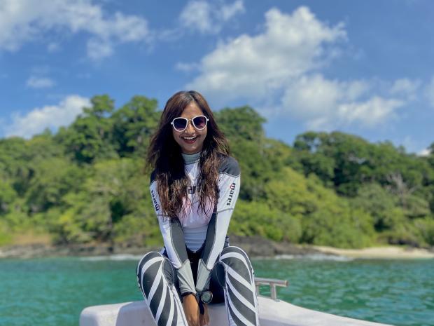 Sharanya Iyer smiling for the camera before diving